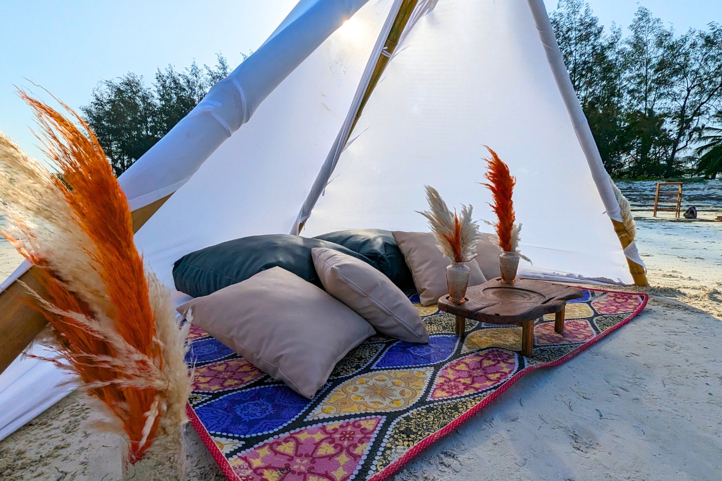 Intimate proposal picnic beneath a white canopy on Diani Beach